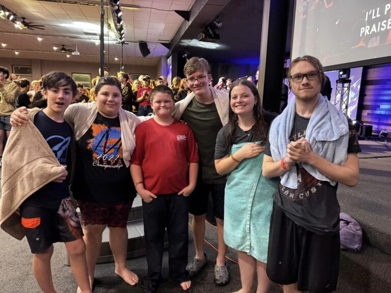 Youth group meeting inside the auditorium at Cross Oak Camp & Retreat Center